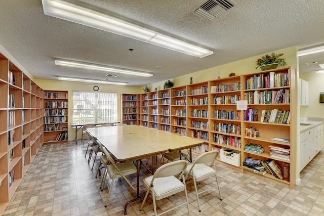 interior space with a textured ceiling