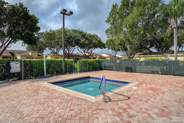 view of swimming pool with a patio area