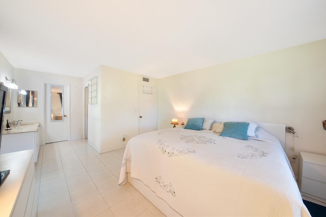 tiled bedroom with sink