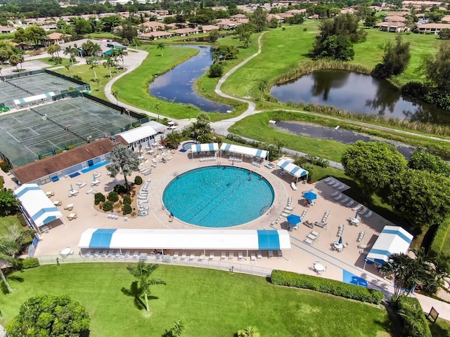 birds eye view of property with a water view