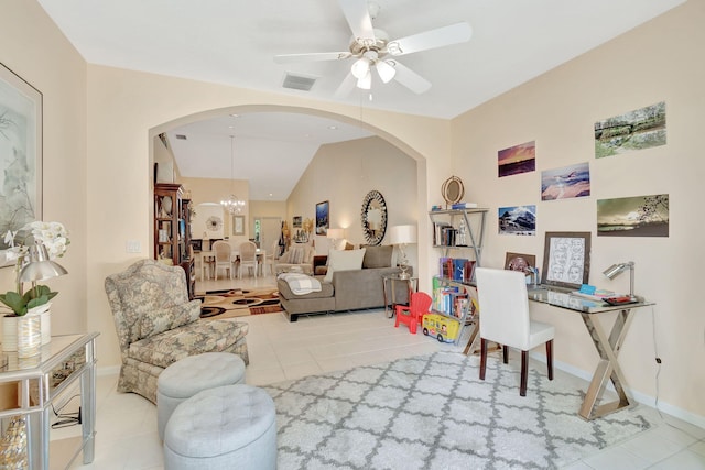 living room with light tile patterned floors, ceiling fan with notable chandelier, and lofted ceiling