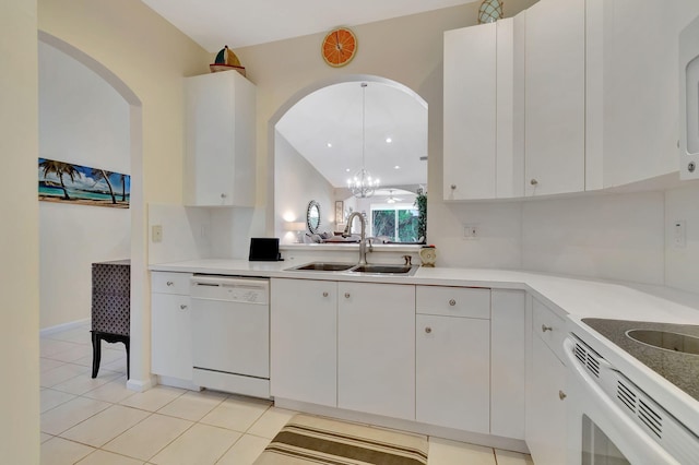 kitchen featuring a notable chandelier, white cabinetry, light tile patterned floors, sink, and white dishwasher