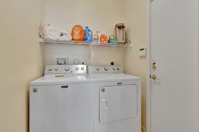 laundry area featuring washing machine and clothes dryer