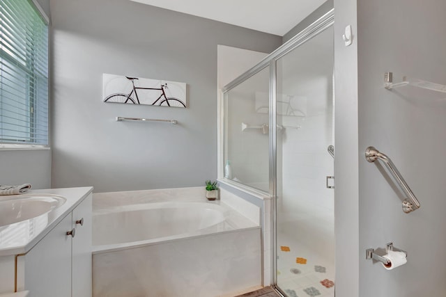 bathroom featuring vanity and plus walk in shower