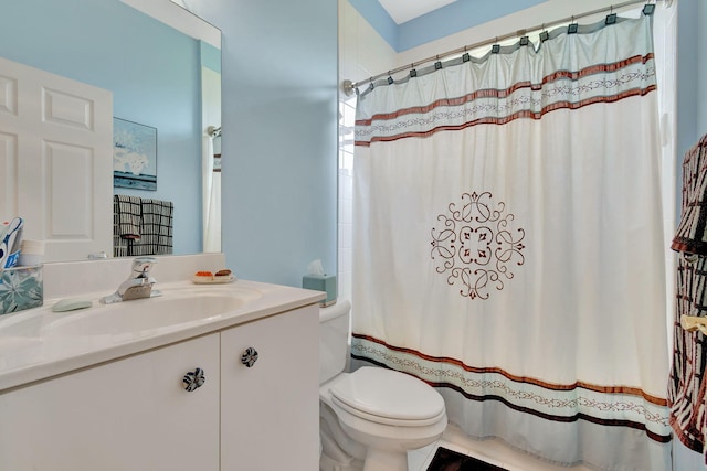 full bathroom featuring shower / bath combo, toilet, and vanity