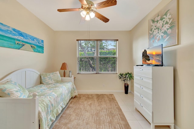 tiled bedroom with ceiling fan