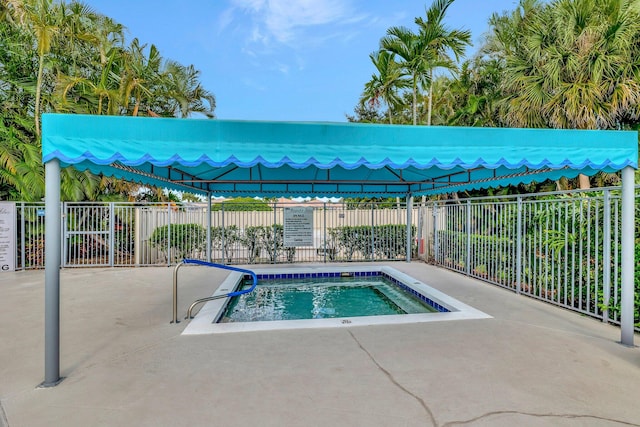 view of swimming pool featuring a community hot tub