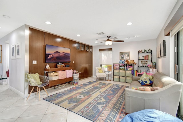 tiled living room featuring ceiling fan