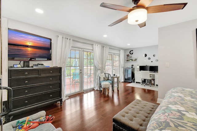 living room with dark hardwood / wood-style floors, ceiling fan, and french doors