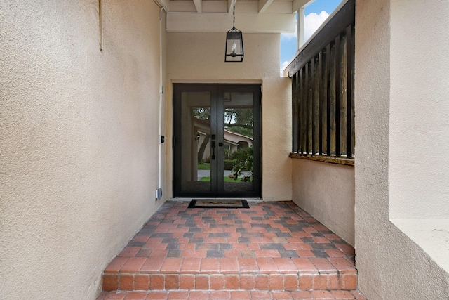 property entrance featuring french doors