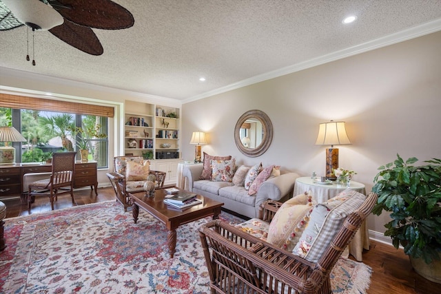 living room with a textured ceiling, ceiling fan, and dark hardwood / wood-style floors