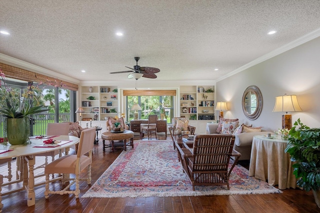 living room with a textured ceiling, ceiling fan, ornamental molding, and dark hardwood / wood-style flooring