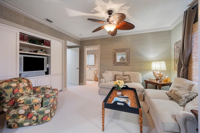 carpeted living room with ceiling fan, crown molding, and a textured ceiling