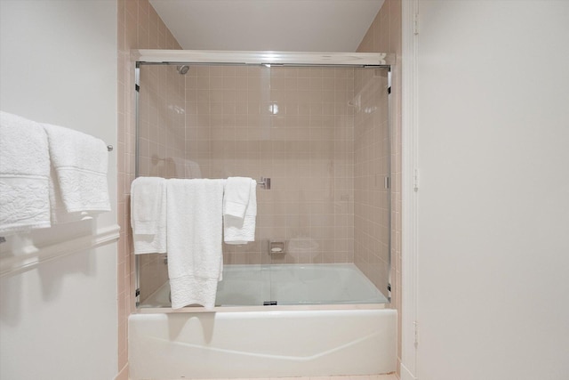 full bathroom featuring combined bath / shower with glass door