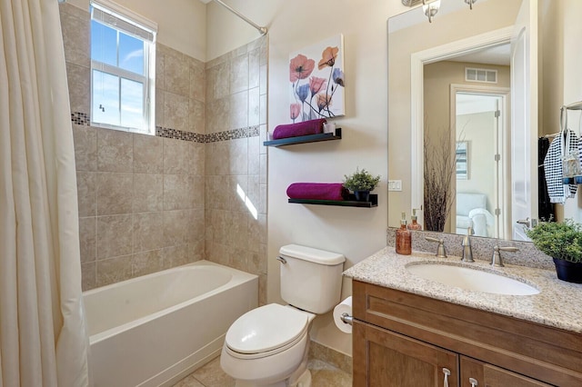 full bathroom featuring tile patterned flooring, shower / bath combo, vanity, and toilet