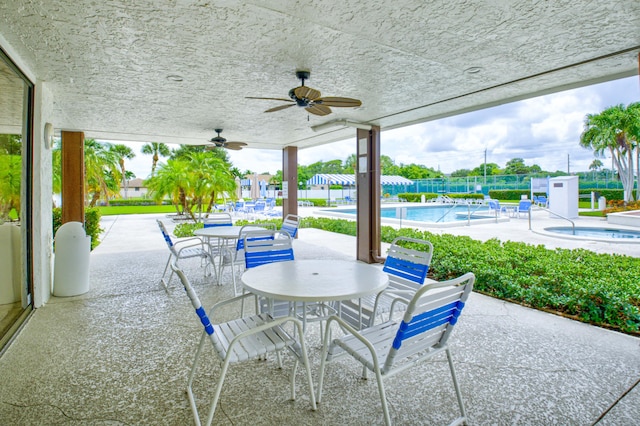 view of patio / terrace featuring ceiling fan and a community pool