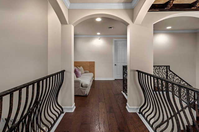 hall with dark hardwood / wood-style flooring and ornamental molding