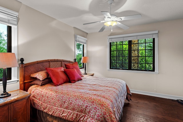 bedroom featuring ceiling fan and dark wood-type flooring