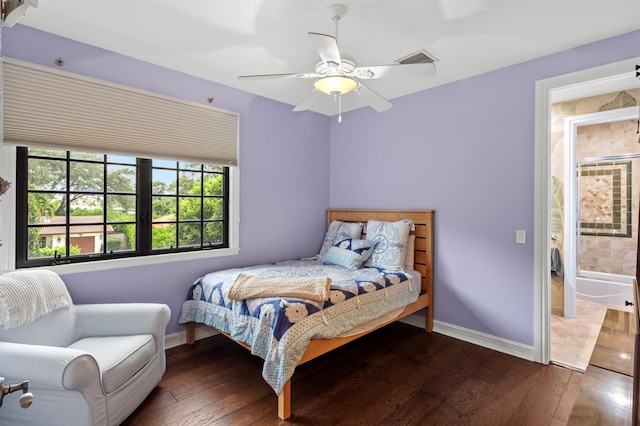 bedroom with ceiling fan and dark hardwood / wood-style flooring