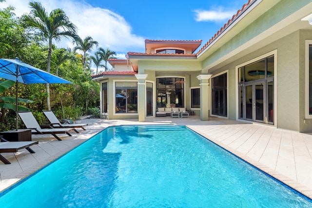 view of swimming pool with a patio