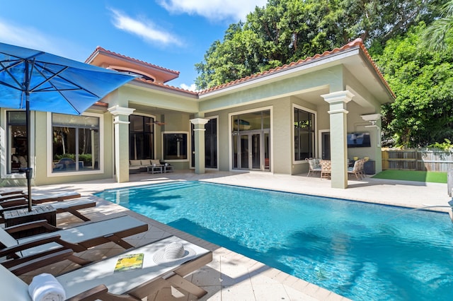 view of swimming pool with a patio area