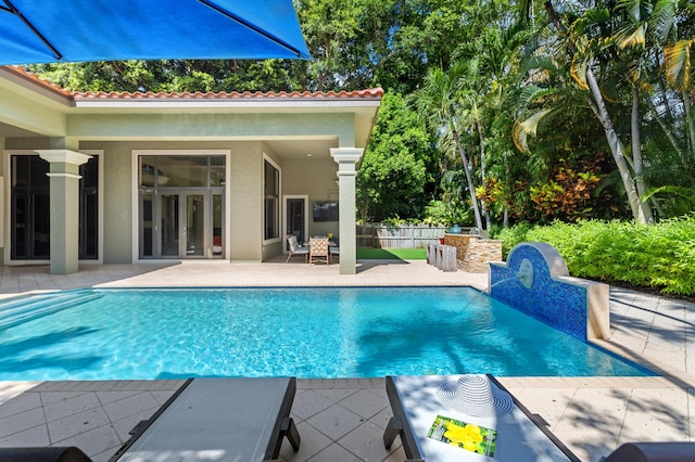 view of swimming pool featuring a patio area