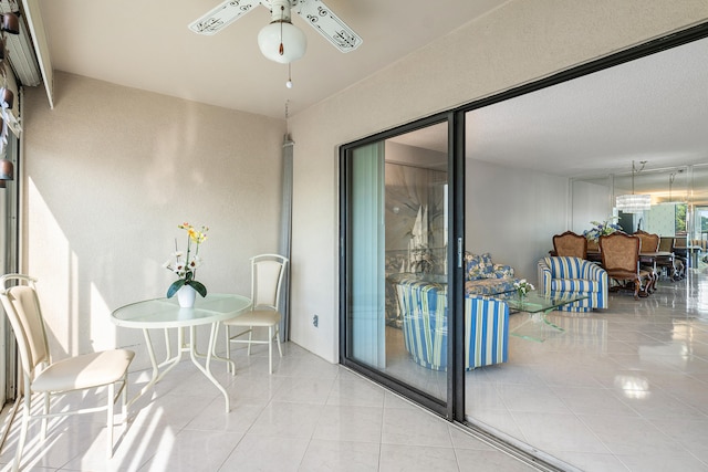 sunroom / solarium with ceiling fan