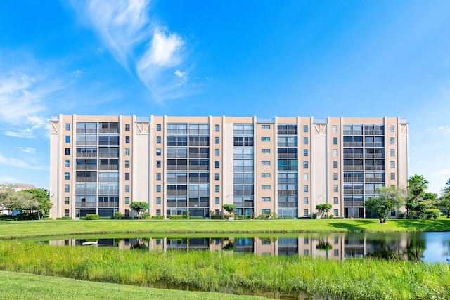 view of building exterior with a water view