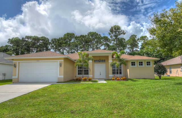 view of front of house with a garage and a front yard