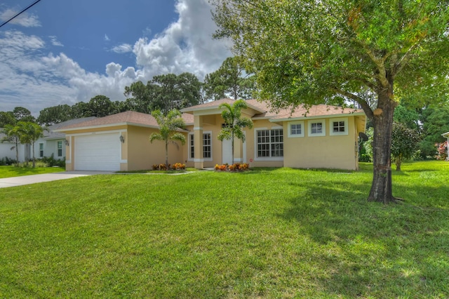 single story home with a garage and a front lawn