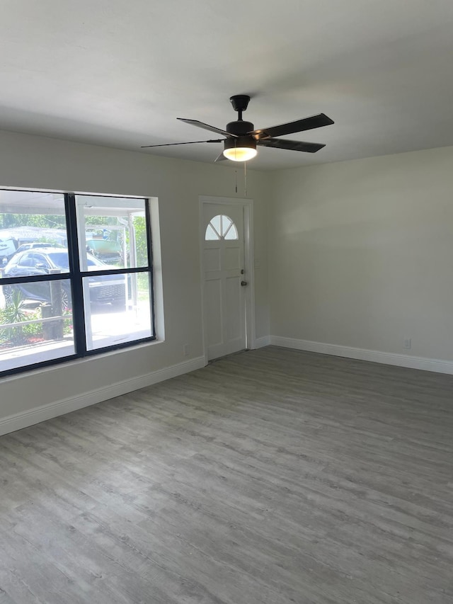 entryway with hardwood / wood-style flooring and ceiling fan