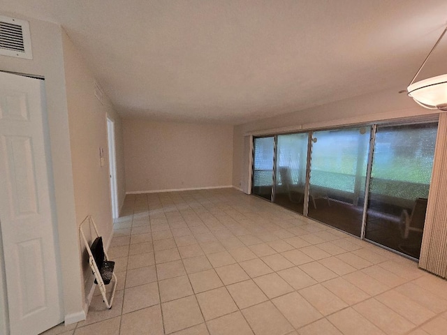 empty room featuring light tile patterned floors