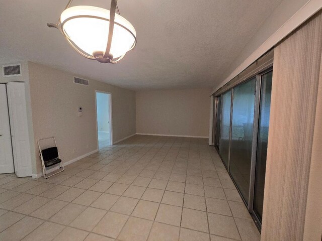 interior space with a textured ceiling