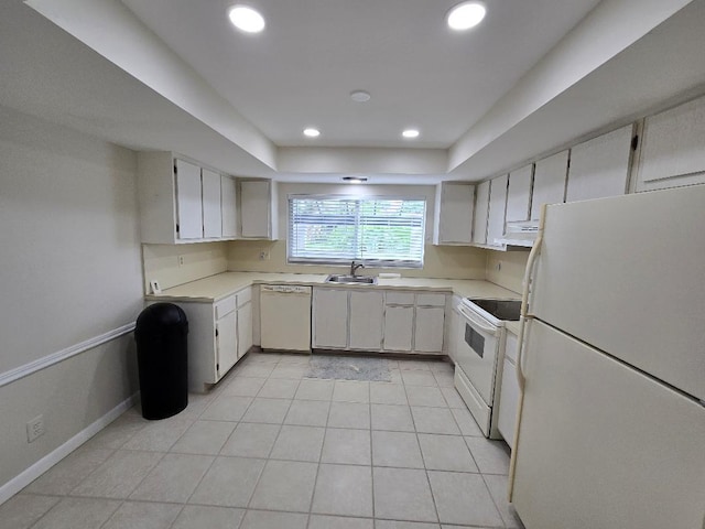 kitchen with white appliances, light tile patterned floors, white cabinetry, and sink