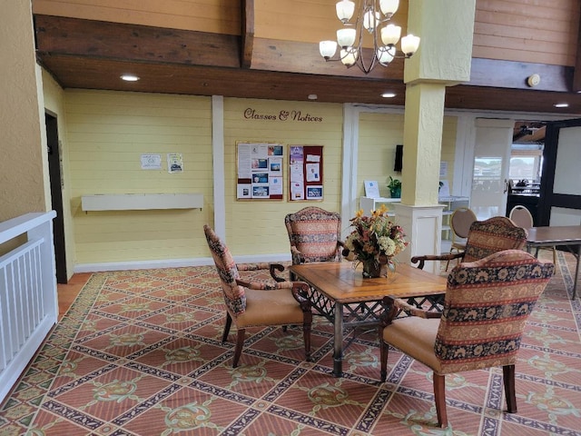 dining room with beam ceiling and a notable chandelier