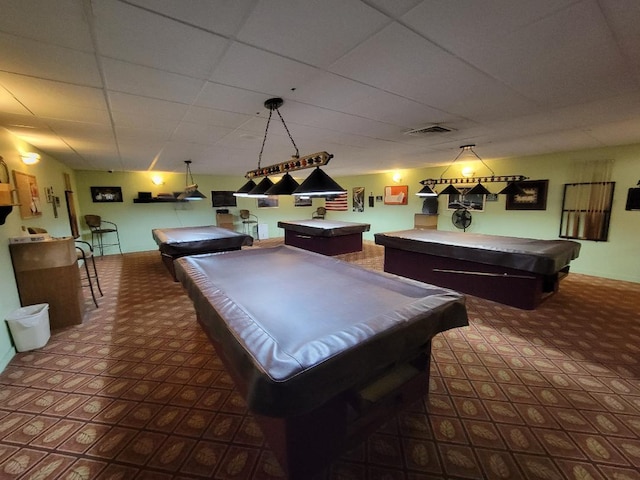 game room with a paneled ceiling and pool table