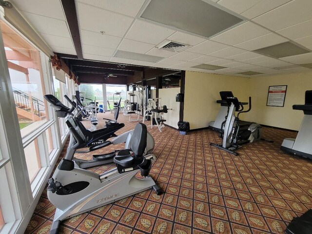 exercise room featuring a drop ceiling