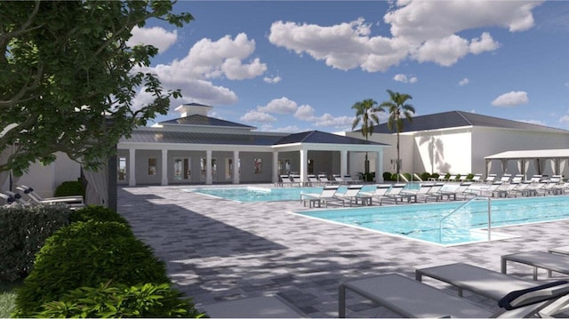 view of swimming pool with a patio area