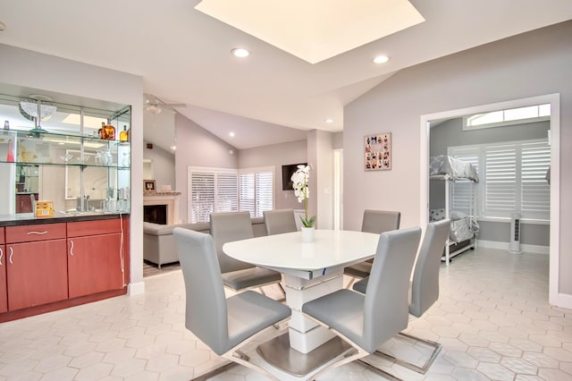 dining space featuring lofted ceiling and ceiling fan