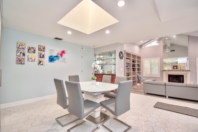 dining room featuring lofted ceiling