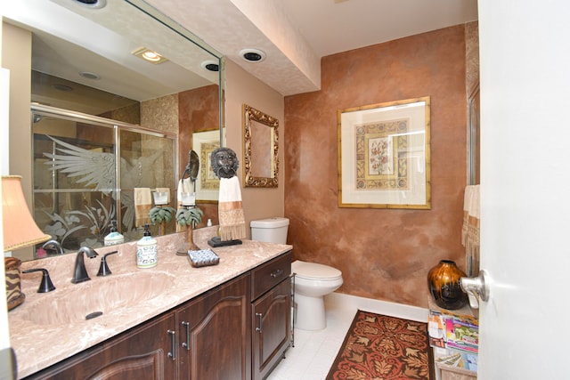 bathroom with an enclosed shower, tile patterned floors, toilet, and vanity