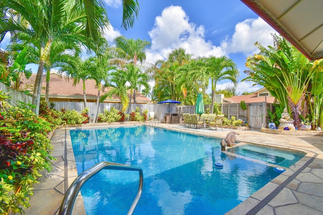 view of swimming pool featuring a patio area