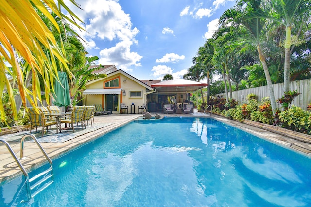 view of pool featuring a patio area