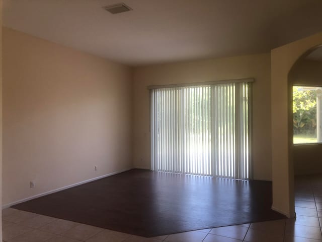 unfurnished room featuring tile patterned floors