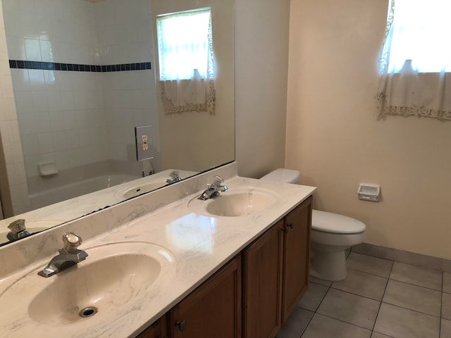 full bathroom with vanity, toilet, tile patterned floors, and bathing tub / shower combination