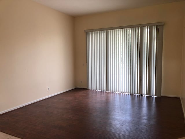 unfurnished room featuring wood-type flooring