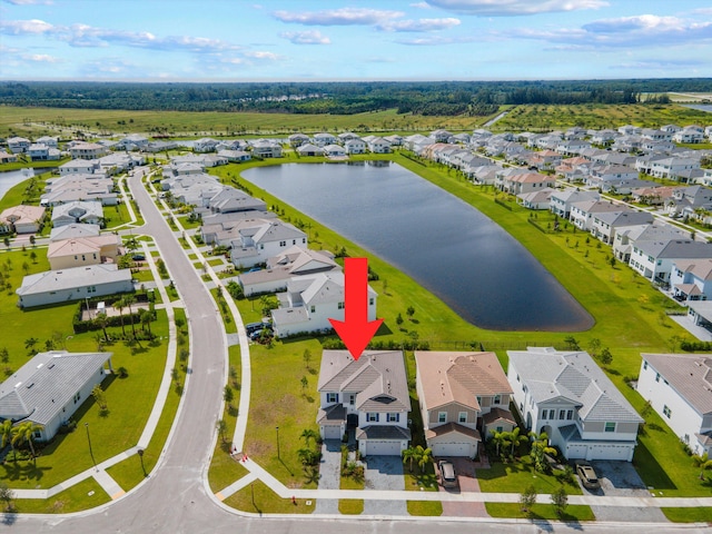 birds eye view of property with a water view