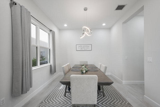 dining space featuring light hardwood / wood-style flooring and a wealth of natural light