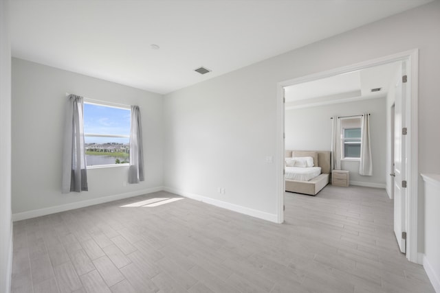 spare room featuring light hardwood / wood-style flooring