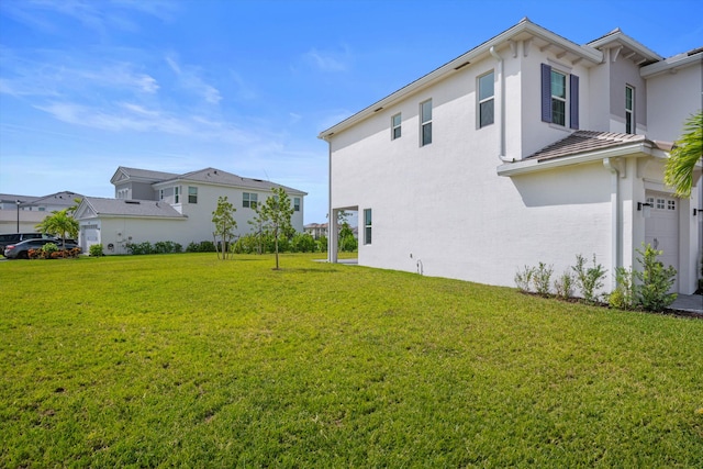 view of yard with a garage